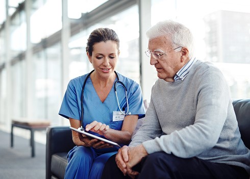 Image of health professional speaking to a patient