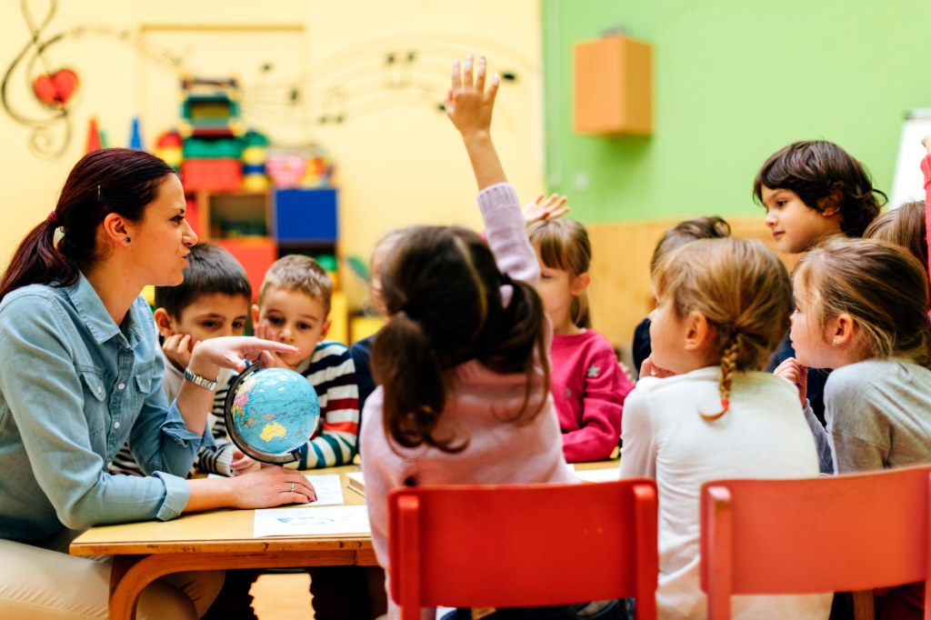 Image of teacher and children in a classroom